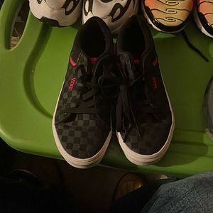Red and black Vans sneakers.